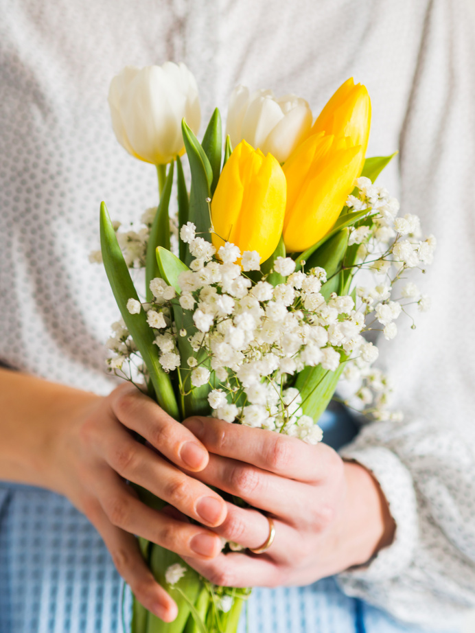Woman Holding Bouquet of Tulips. Woman's Day